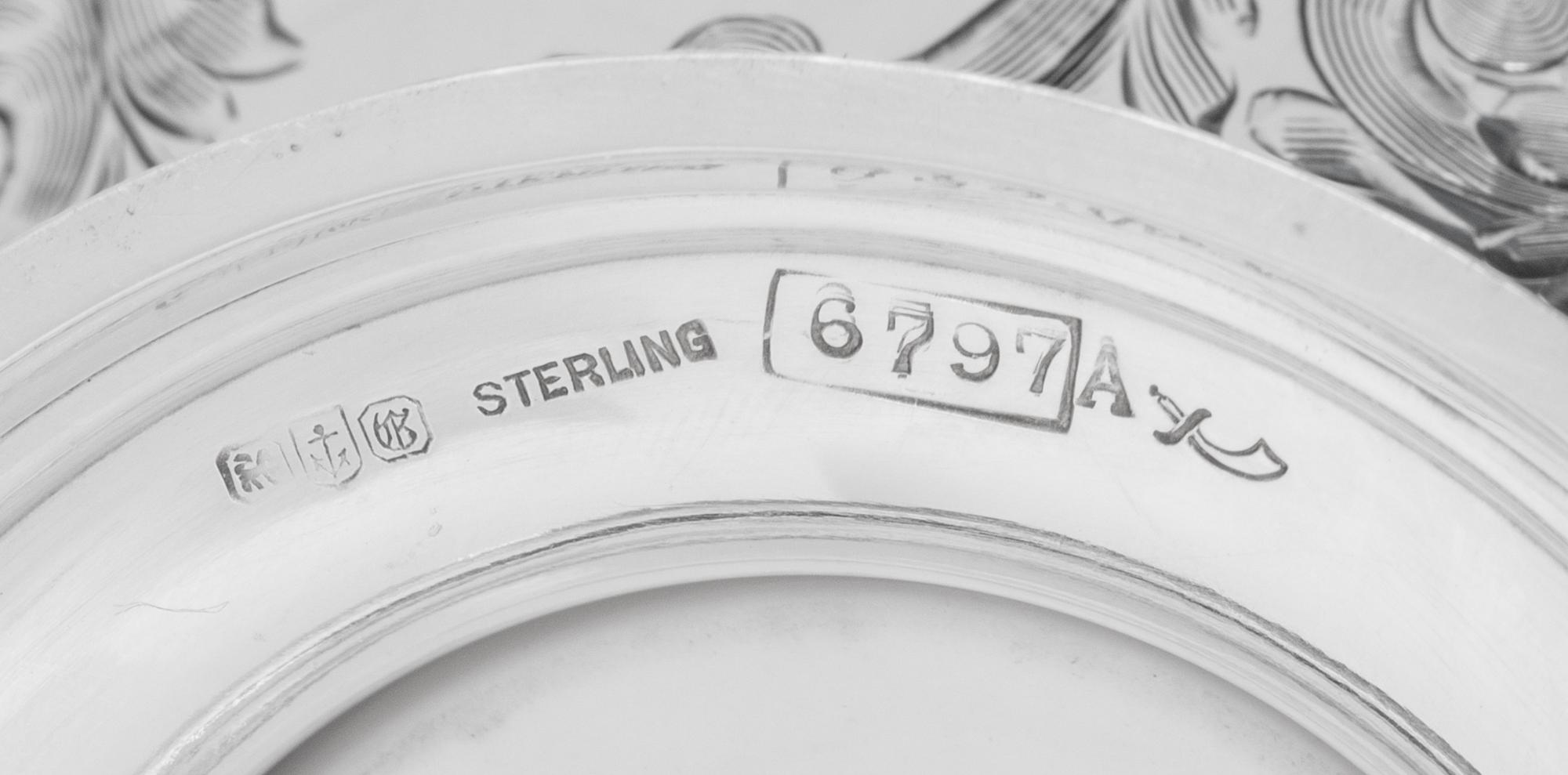 A Set of Twelve American Silver Teacups and Saucers
