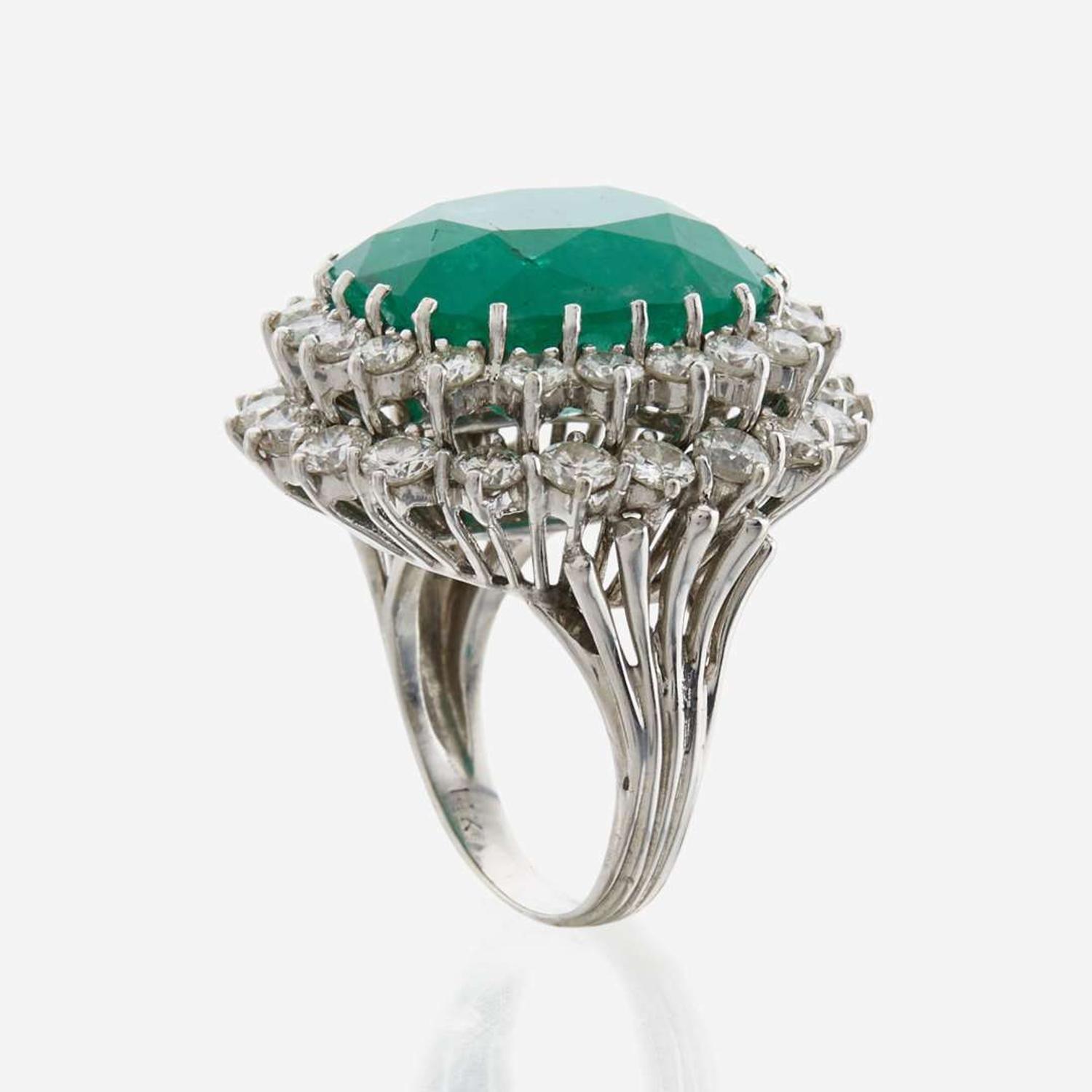 An emerald, diamond and white gold ring