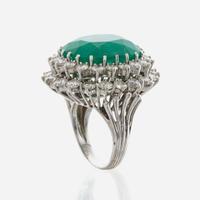 An emerald, diamond and white gold ring