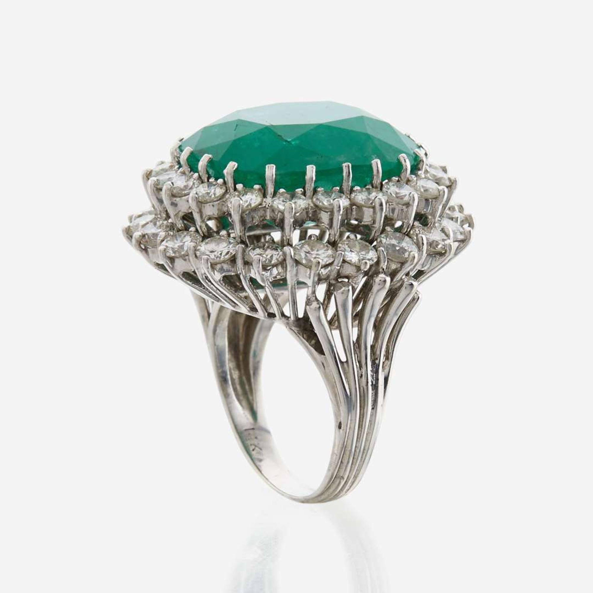 An emerald, diamond and white gold ring