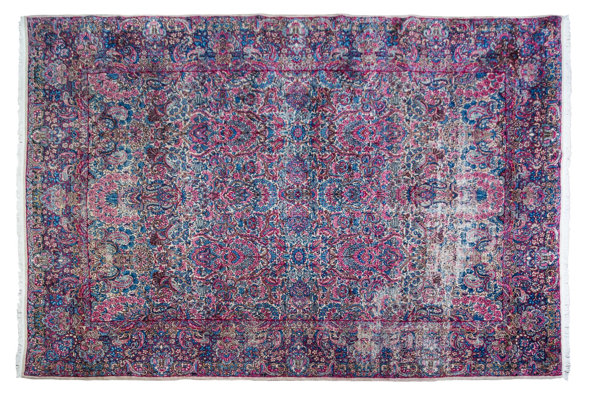 A Kirman Wool Rug 11 feet 9 inches x 8 feet 6 inches. — EARLY TO MID-20TH CENTURY