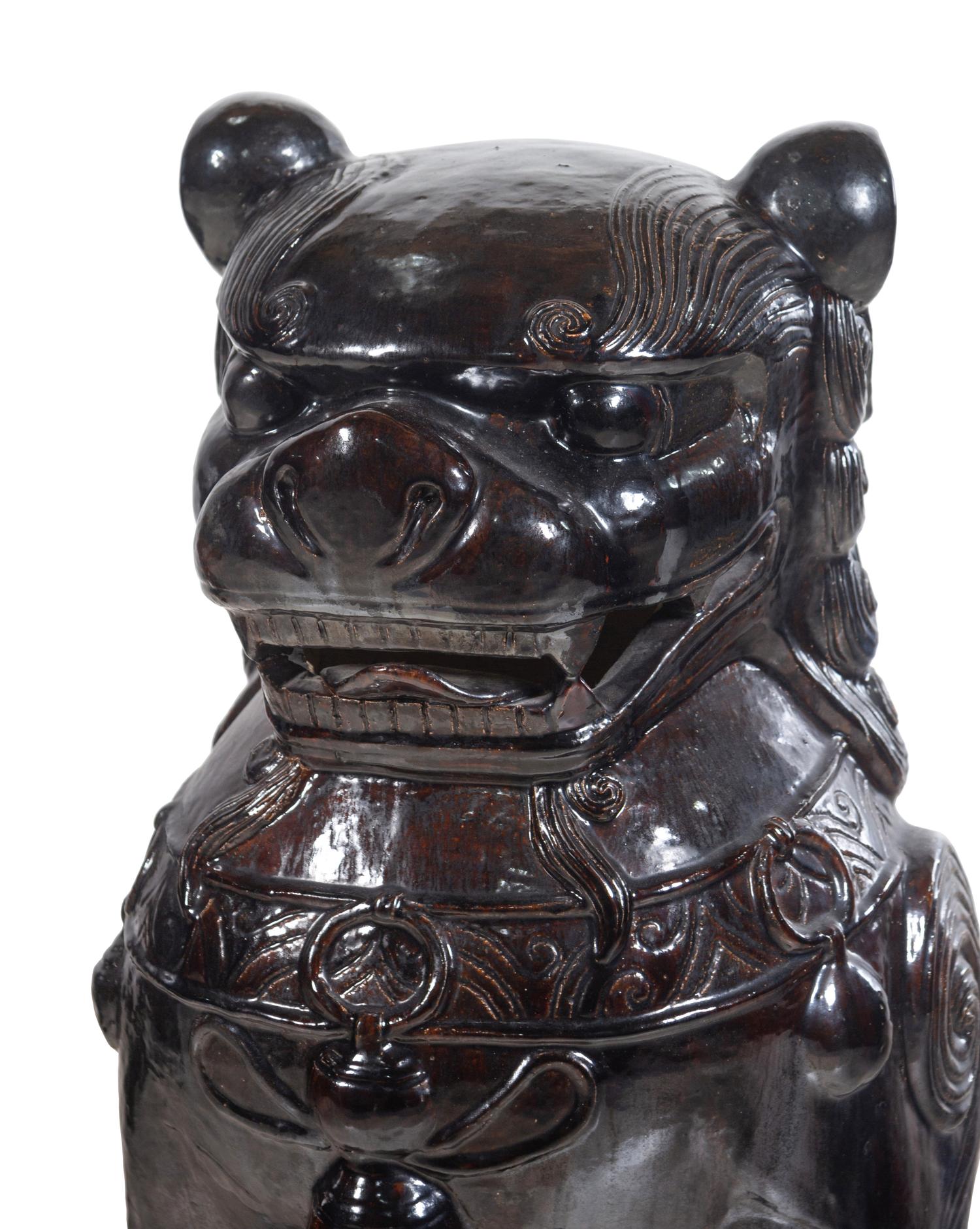 A Large Pair of Chinese Brown Glazed Stoneware Figures of Fu Lions
