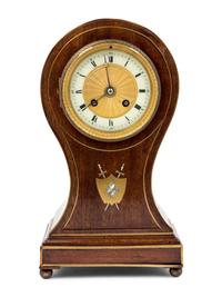 An English Mahogany Balloon Clock