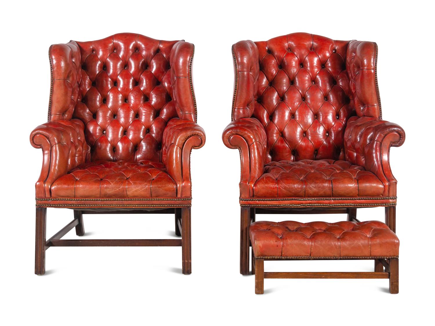 A Pair of Leather Wingback Armchairs with Ottoman