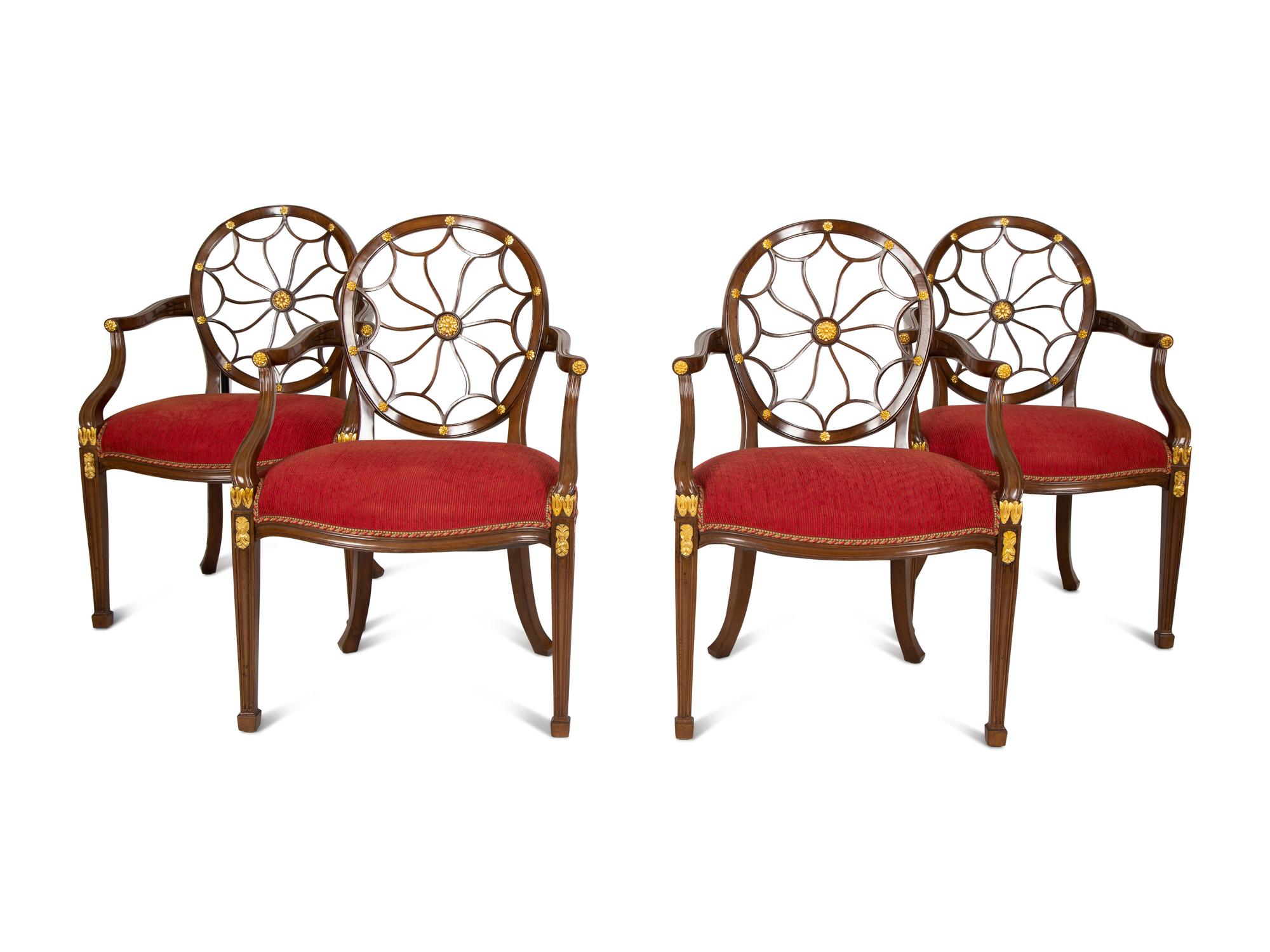 A Set of Eight George III Style Mahogany Wheel Back Armchairs.