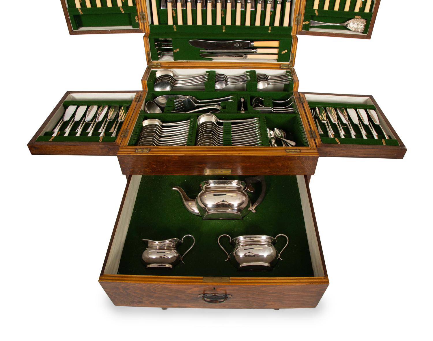An Extensive Silver-Plate Flatware and Tea Service in a Fitted Wooden Case on Mahogany Stand