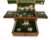 An Extensive Silver-Plate Flatware and Tea Service in a Fitted Wooden Case on Mahogany Stand