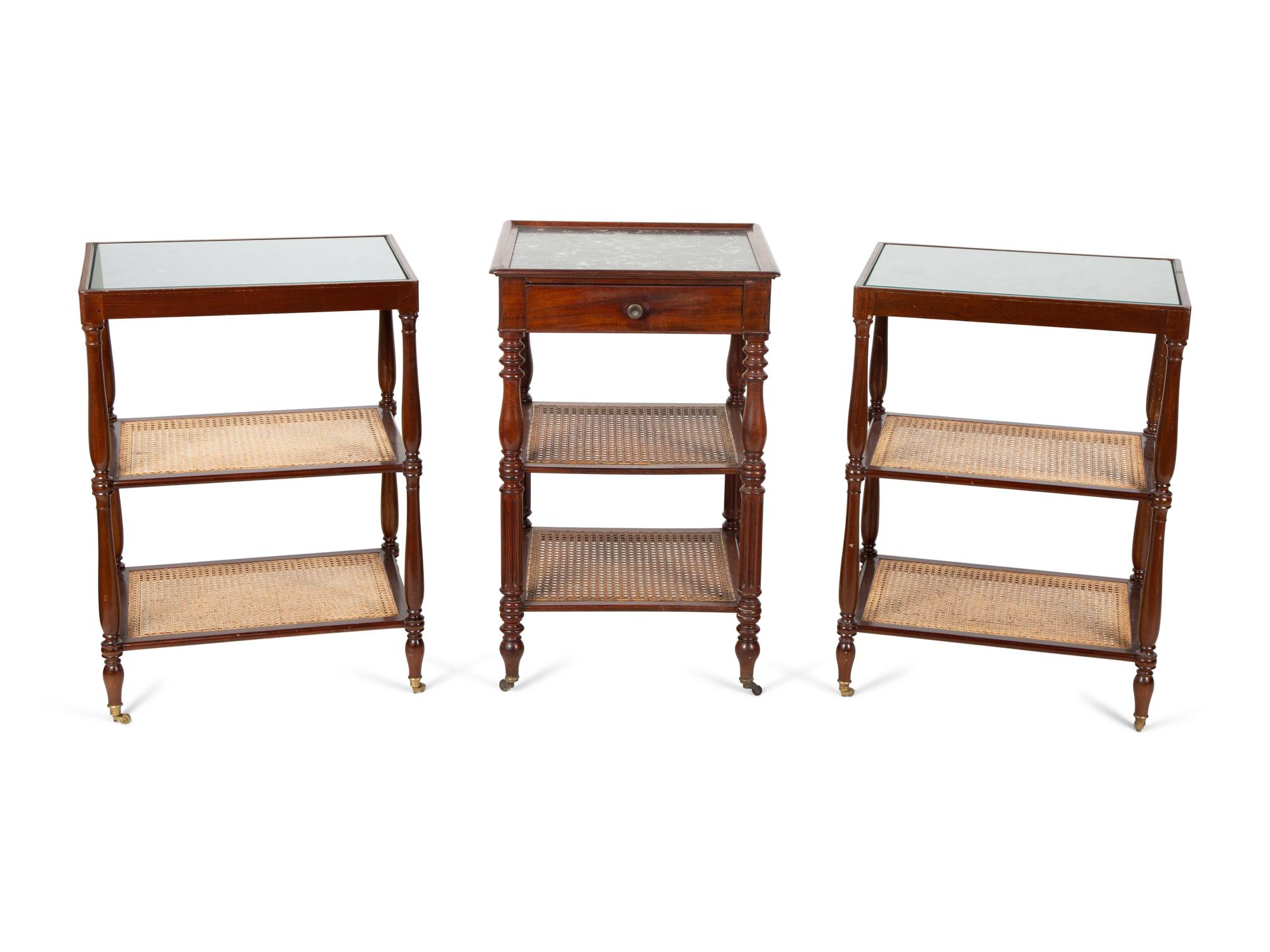 A Group of Three French Mahogany Marble Top Side Tables with Tiered Canework Shelves — EARLY 20TH CENTURY