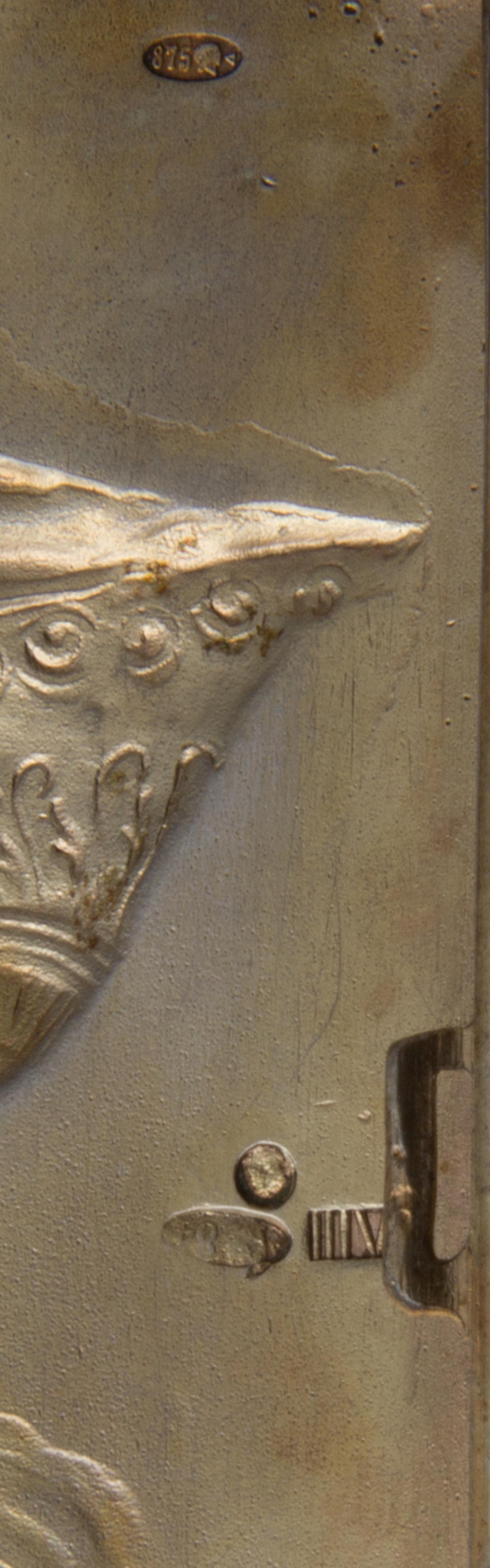 A Russian Silver Cigarette Case, Maker's Mark Obscured, Moscow, Early 20th Century, the lid worked to show the personification of Mothe