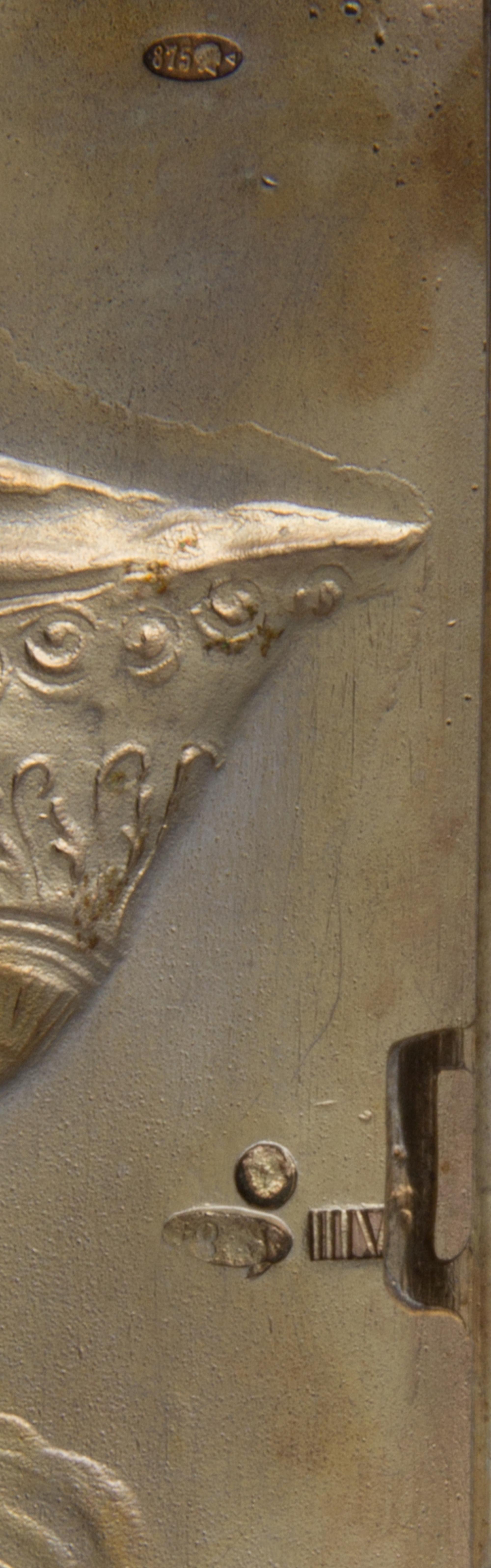 A Russian Silver Cigarette Case, Maker's Mark Obscured, Moscow, Early 20th Century, the lid worked to show the personification of Mothe