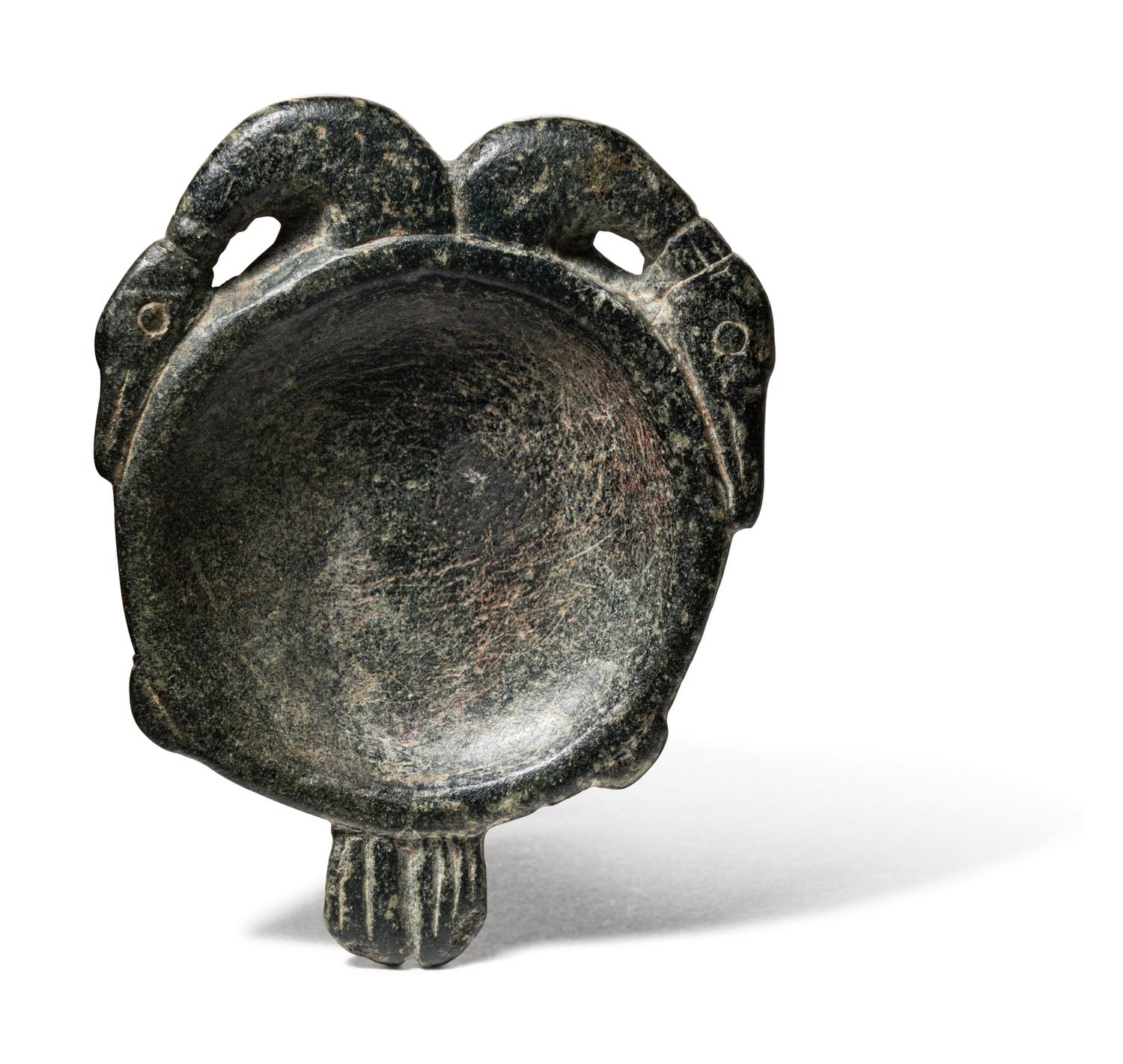 An Egyptian Steatite Cosmetic Palette in the Form of a Double Duck