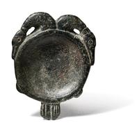 An Egyptian Steatite Cosmetic Palette in the Form of a Double Duck