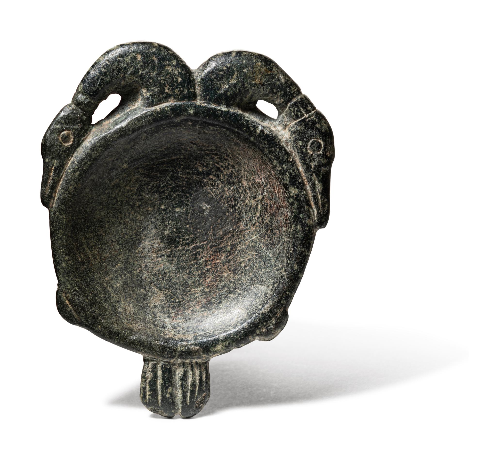 An Egyptian Steatite Cosmetic Palette in the Form of a Double Duck