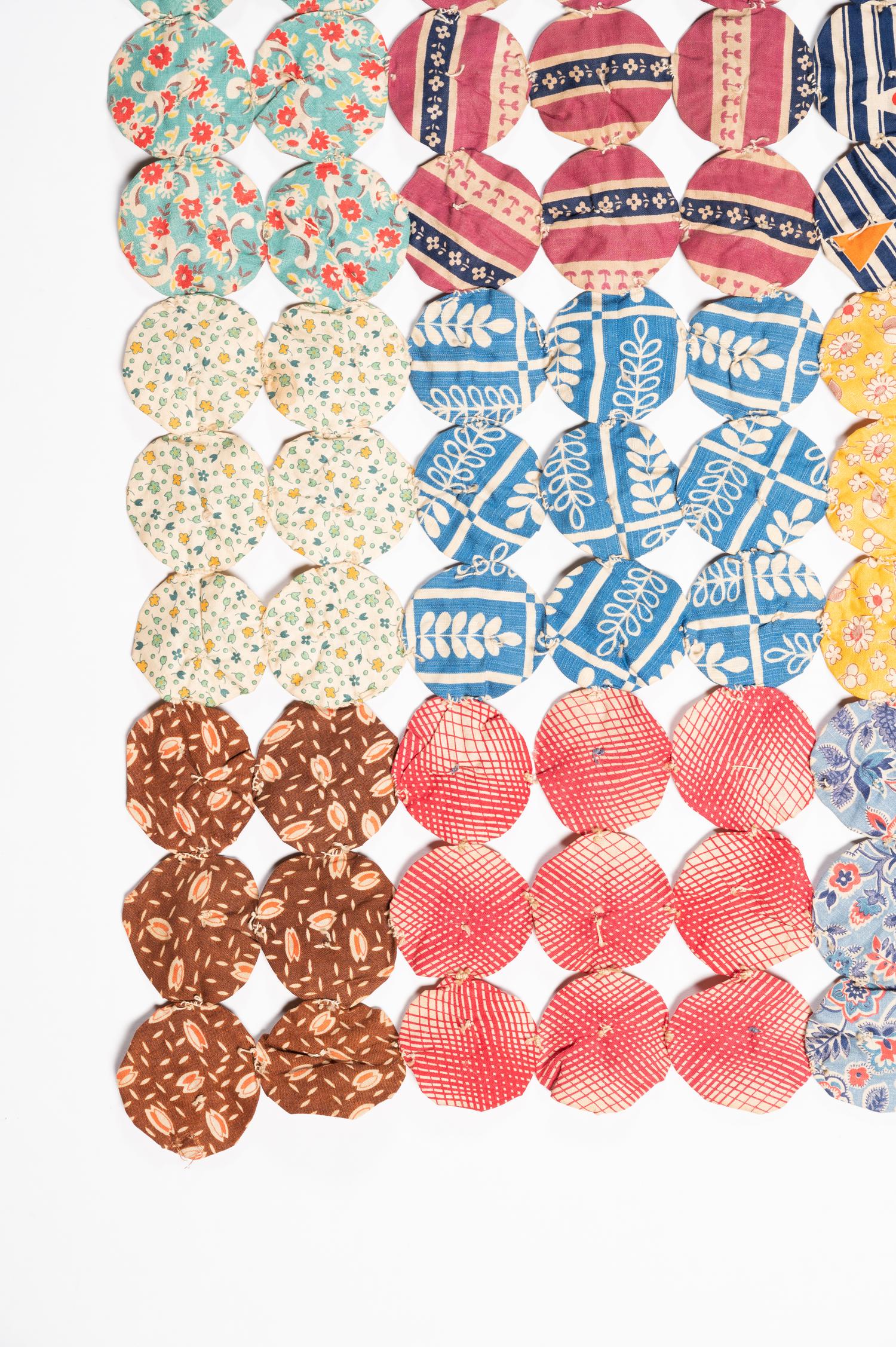 A Pieced Cotton Yo-Yo Quilt