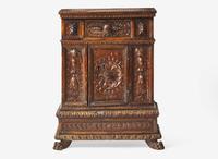 An Italian Renaissance carved walnut cabinet, 16th / 17th century