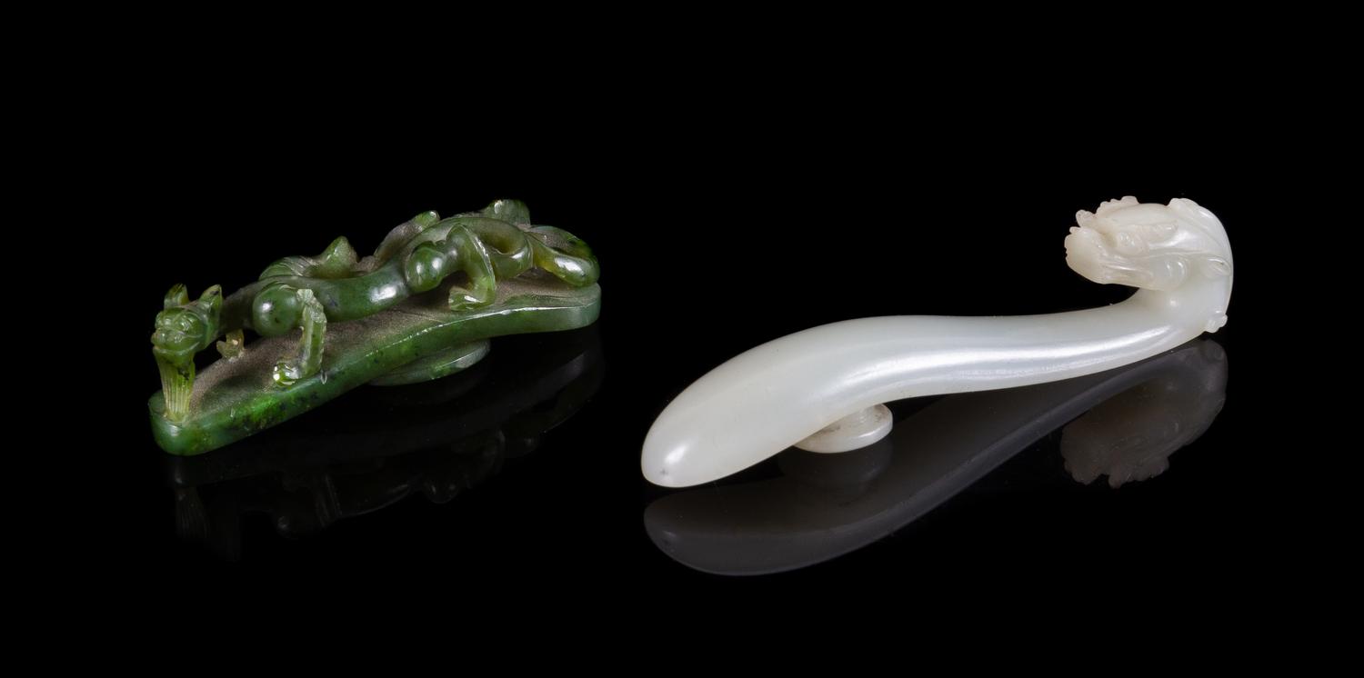 Two Carved Jade Belt Hooks Length of larger 3 1/2 inches.