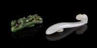 Two Carved Jade Belt Hooks Length of larger 3 1/2 inches.