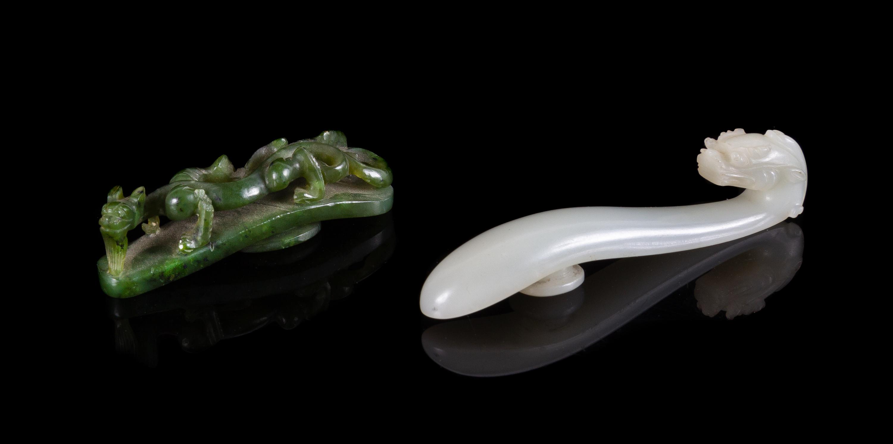 Two Carved Jade Belt Hooks Length of larger 3 1/2 inches.