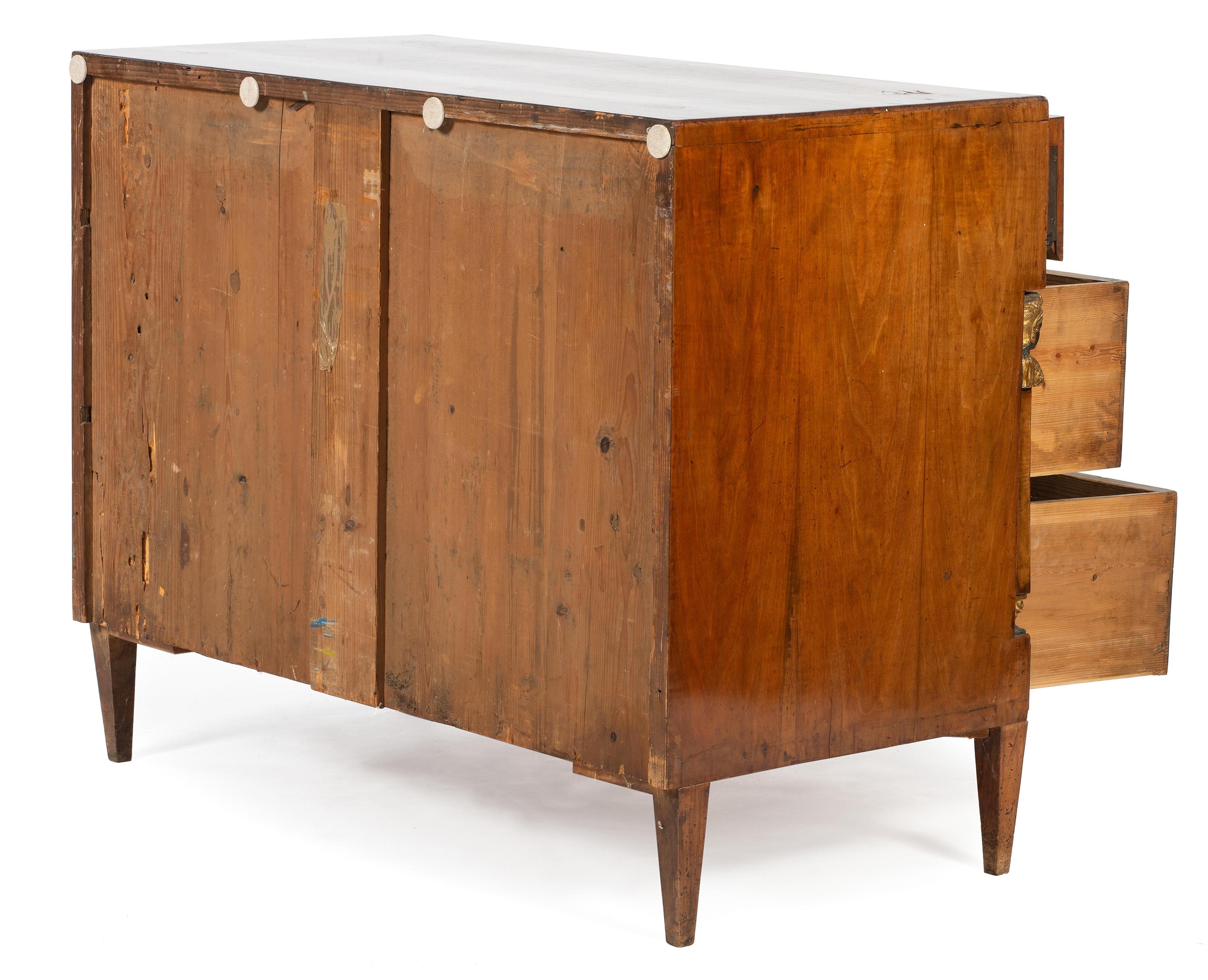 An Empire Style Egyptian Revival Burlwood Commode