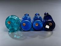 Seven Enameled Glass Barber Items