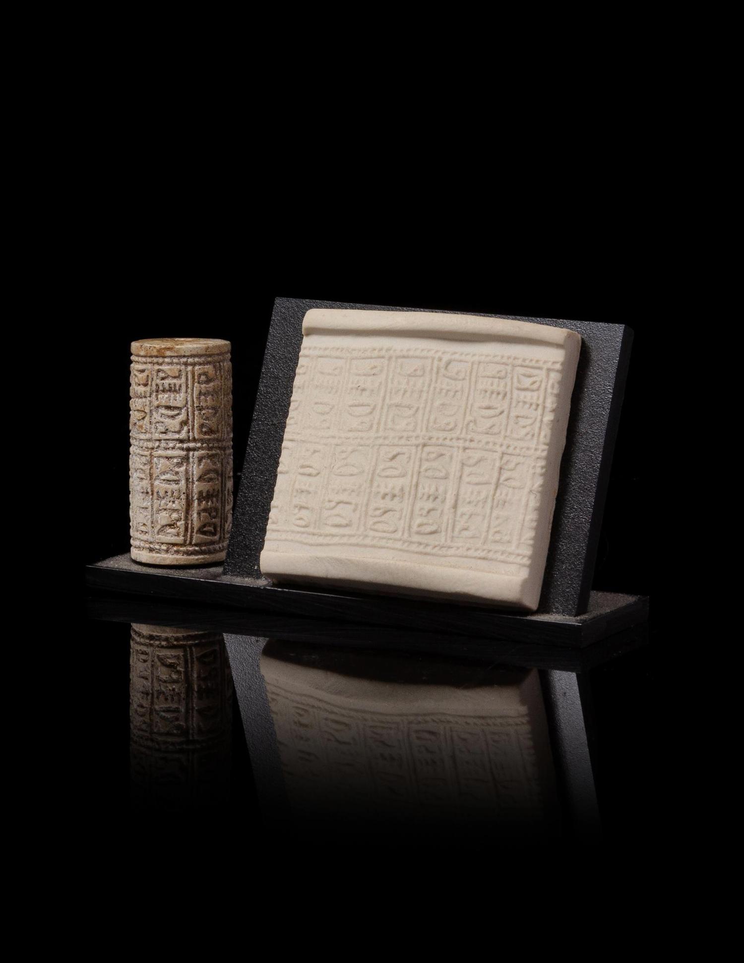An Egyptian Glazed Steatite Cylinder Seal