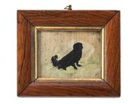 A Cut Paper Silhouette of a Dog