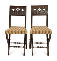 A Pair of Continental Carved Oak 'Gothic' Folding Chairs