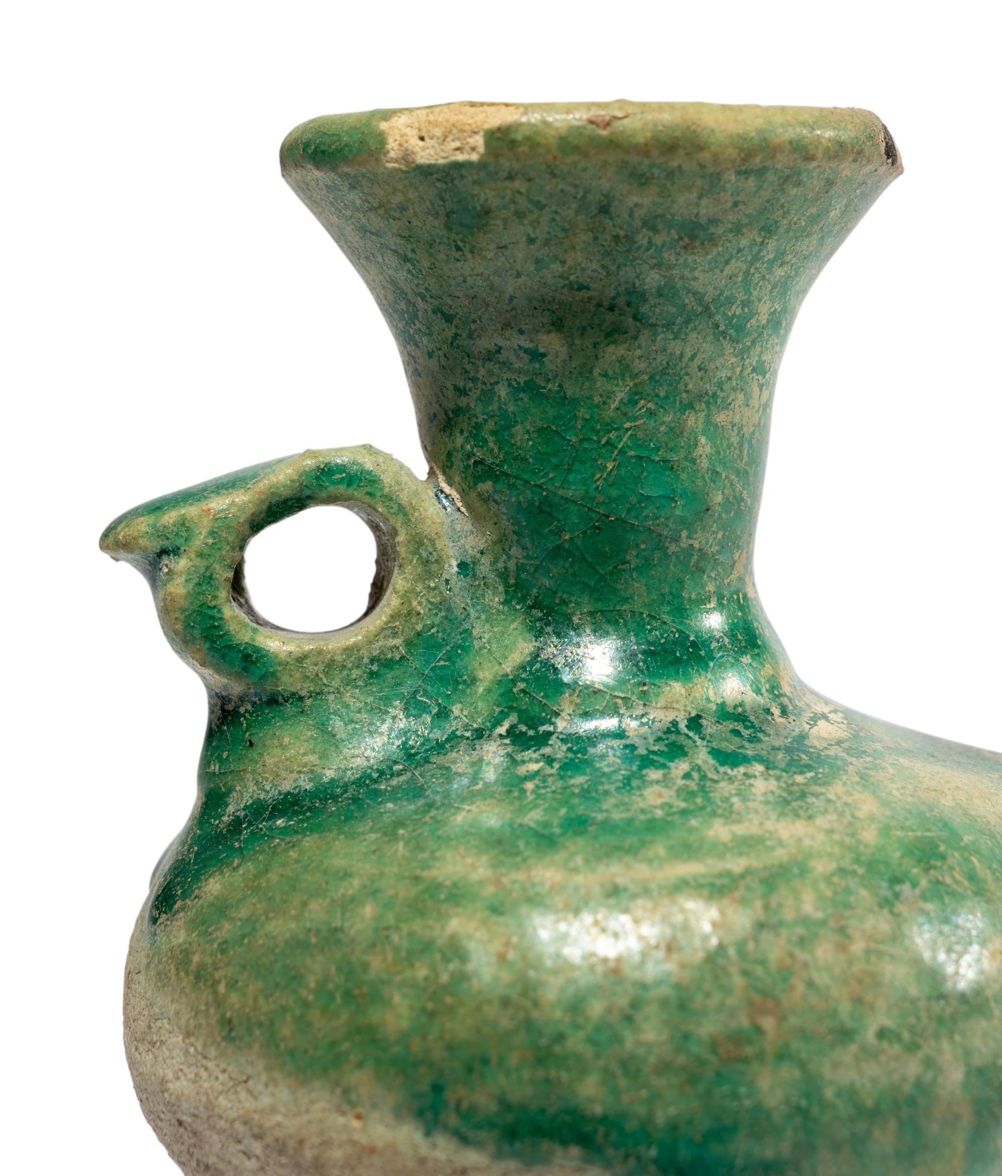 A Persian Green Glazed Vessel