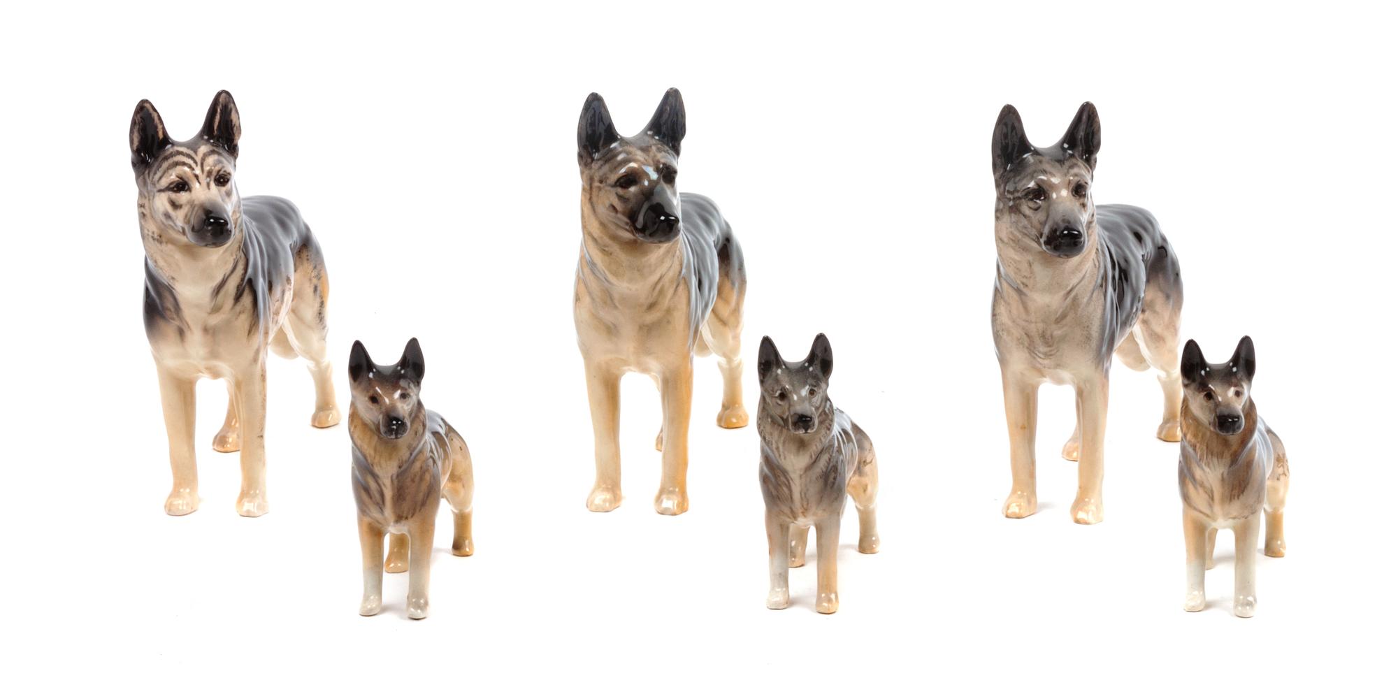 A Group of Six Bewsick Porcelain German Shepherds Width of widest 7 inches.