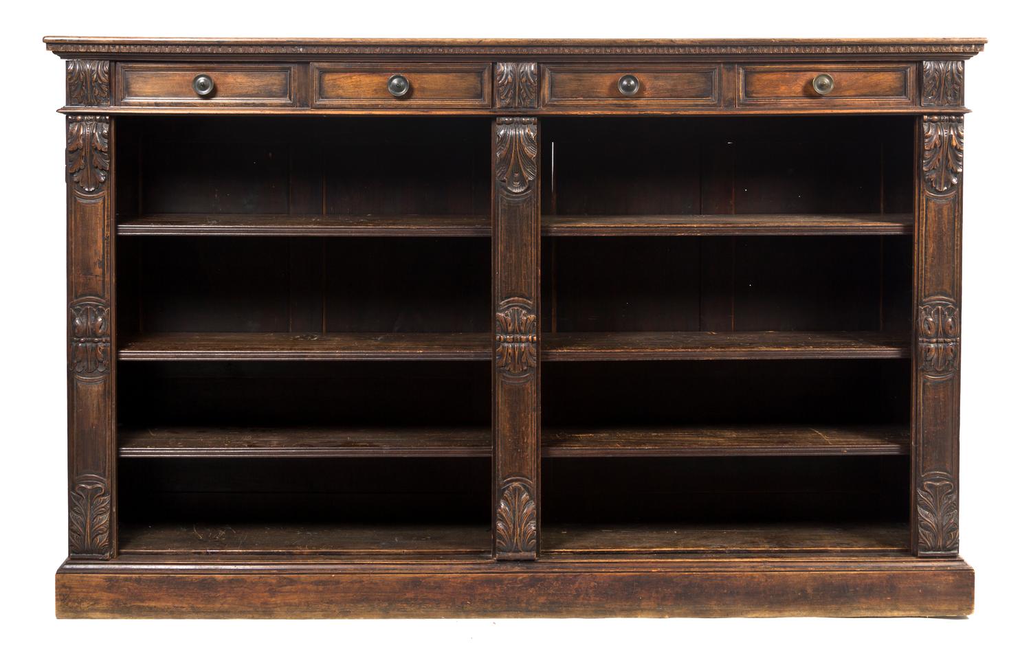 A Continental Walnut Bookcase, Height 51 x width 82 x depth 15 3/4 inches.