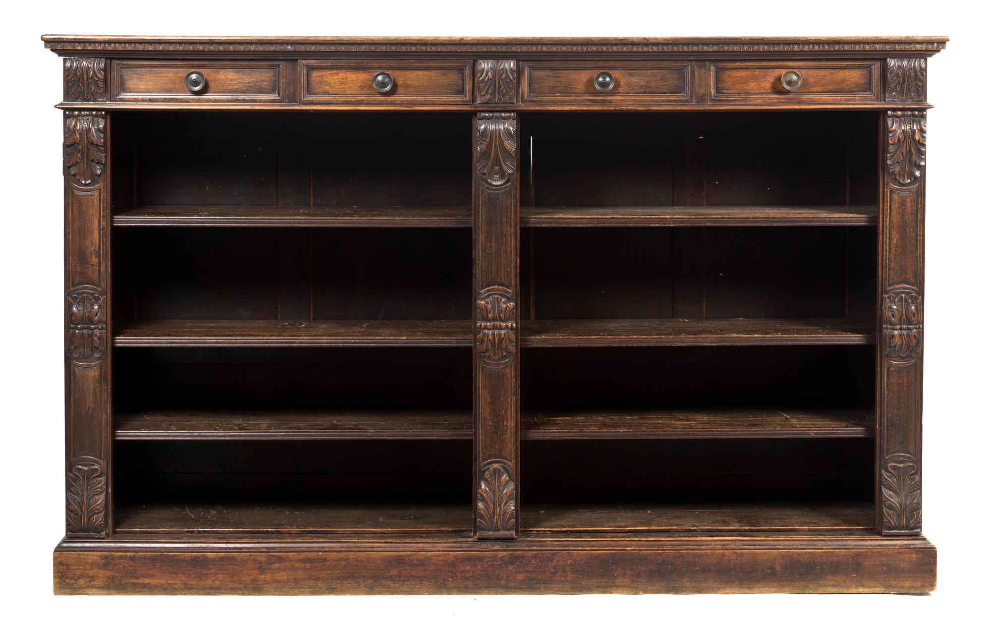 A Continental Walnut Bookcase, Height 51 x width 82 x depth 15 3/4 inches.