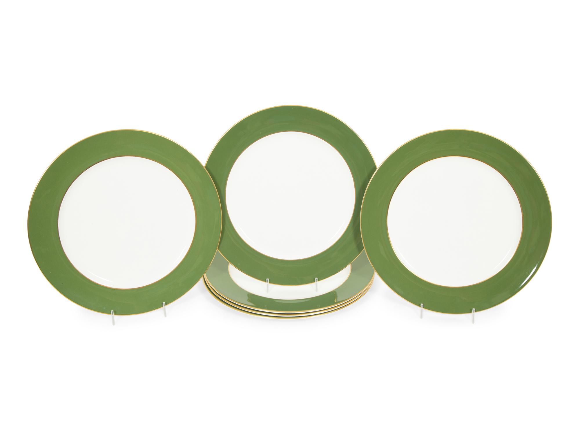 A Set of Fourteen Royal Crown Derby Green Band Chargers