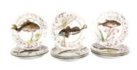 Eleven Limoges Porcelain Fish Plates Diameter 9 1/8 inches.