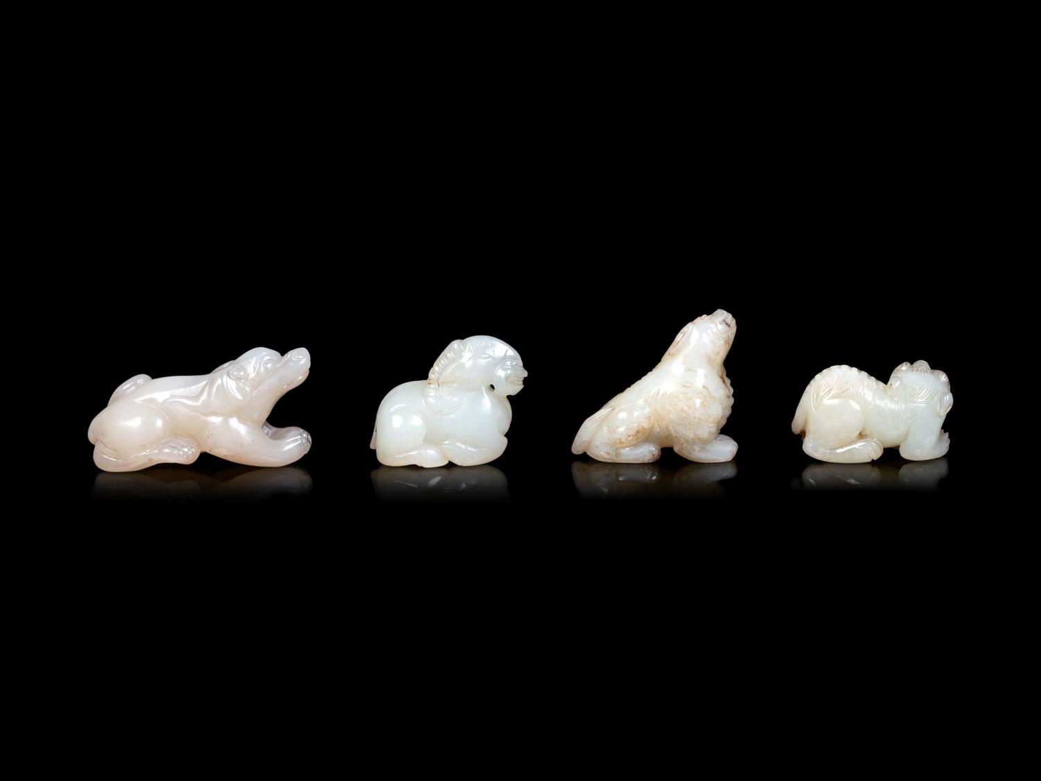 Four Chinese Pale Celadon Jade Carvings of Beasts