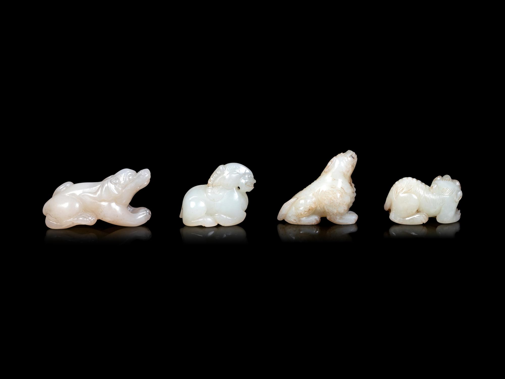 Four Chinese Pale Celadon Jade Carvings of Beasts