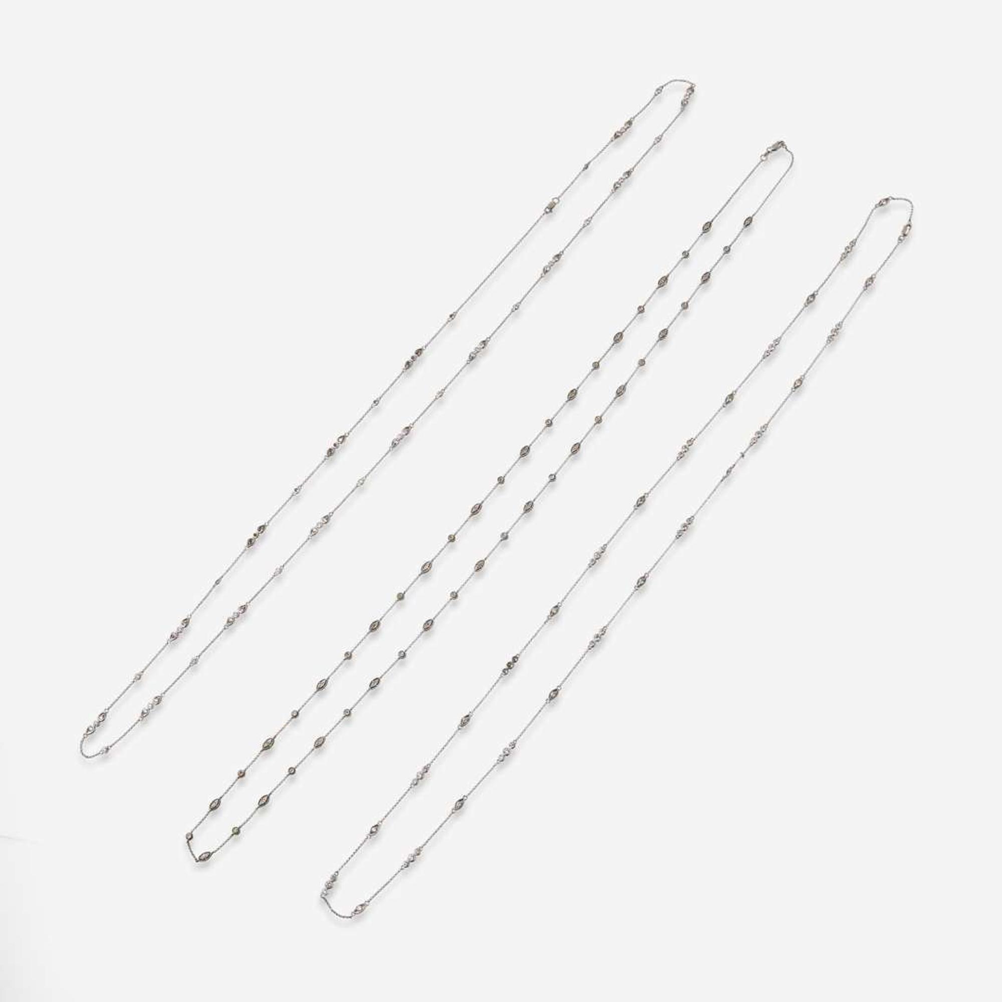 A Set of Three 14K White Gold and Diamond Chains