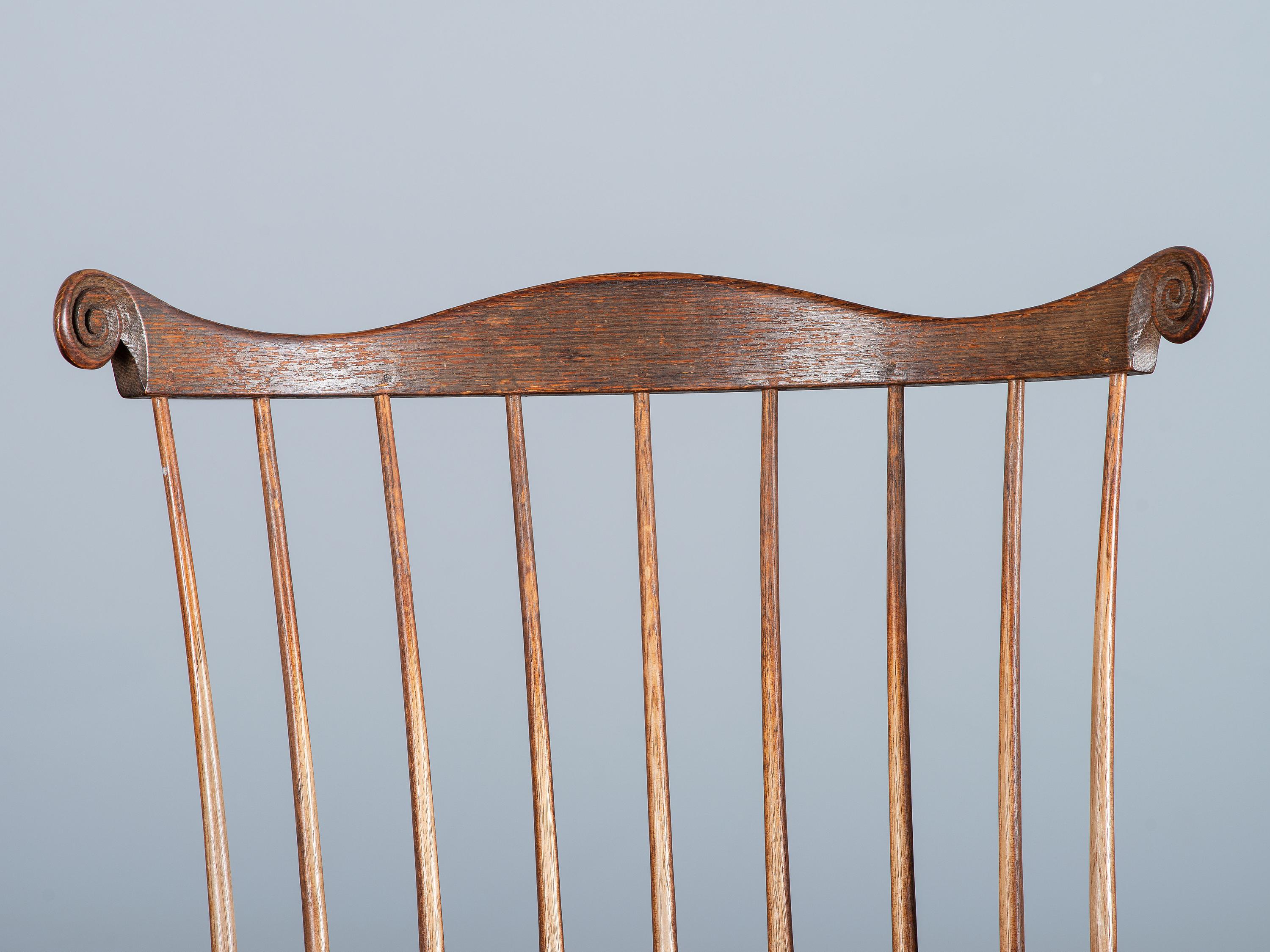 A Volute and Scroll Carved and Reel Turned Windsor Armchair