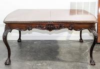 A Chippendale Style Mahogany Dining Table Height 30 1/2 x width 64 x depth 49 1/2 (without leaves). — 20TH CENTURY