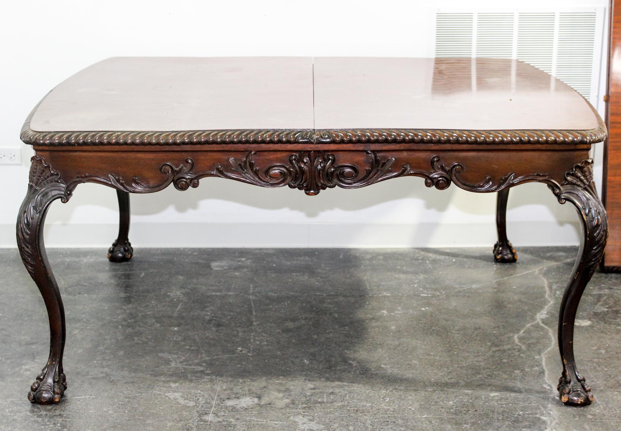 A Chippendale Style Mahogany Dining Table Height 30 1/2 x width 64 x depth 49 1/2 (without leaves). — 20TH CENTURY