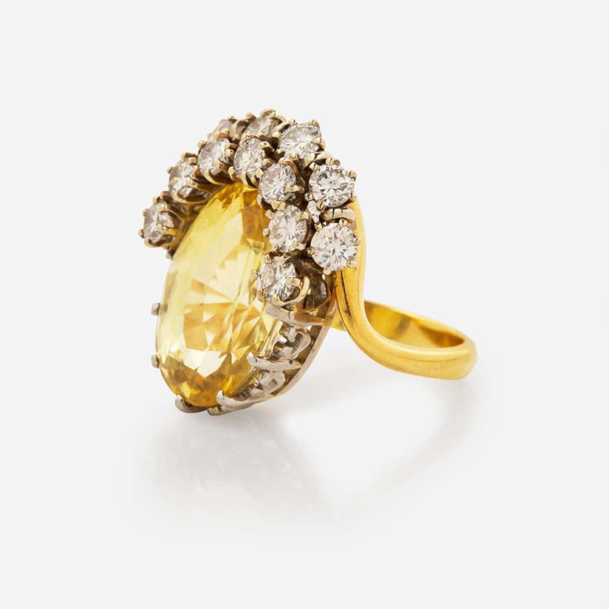 An 18K Yellow Gold, Platinum, Diamond, and Yellow Sapphire Ring