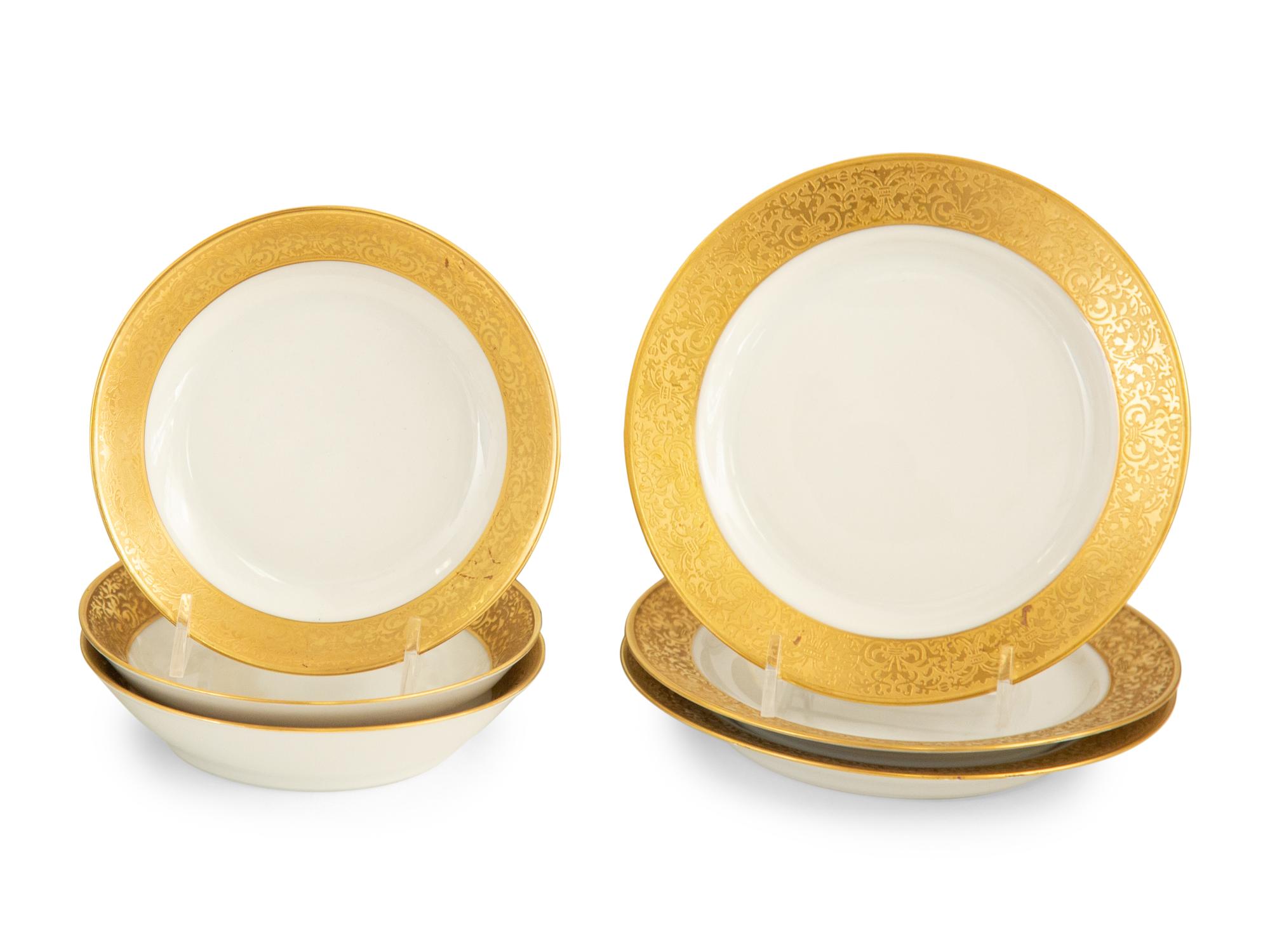 A Bavarian Gilt Decorated Porcelain Dinner Service
