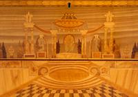 A Late Louis XV Transitional Style Marquetry Commode with Red Onyx Top