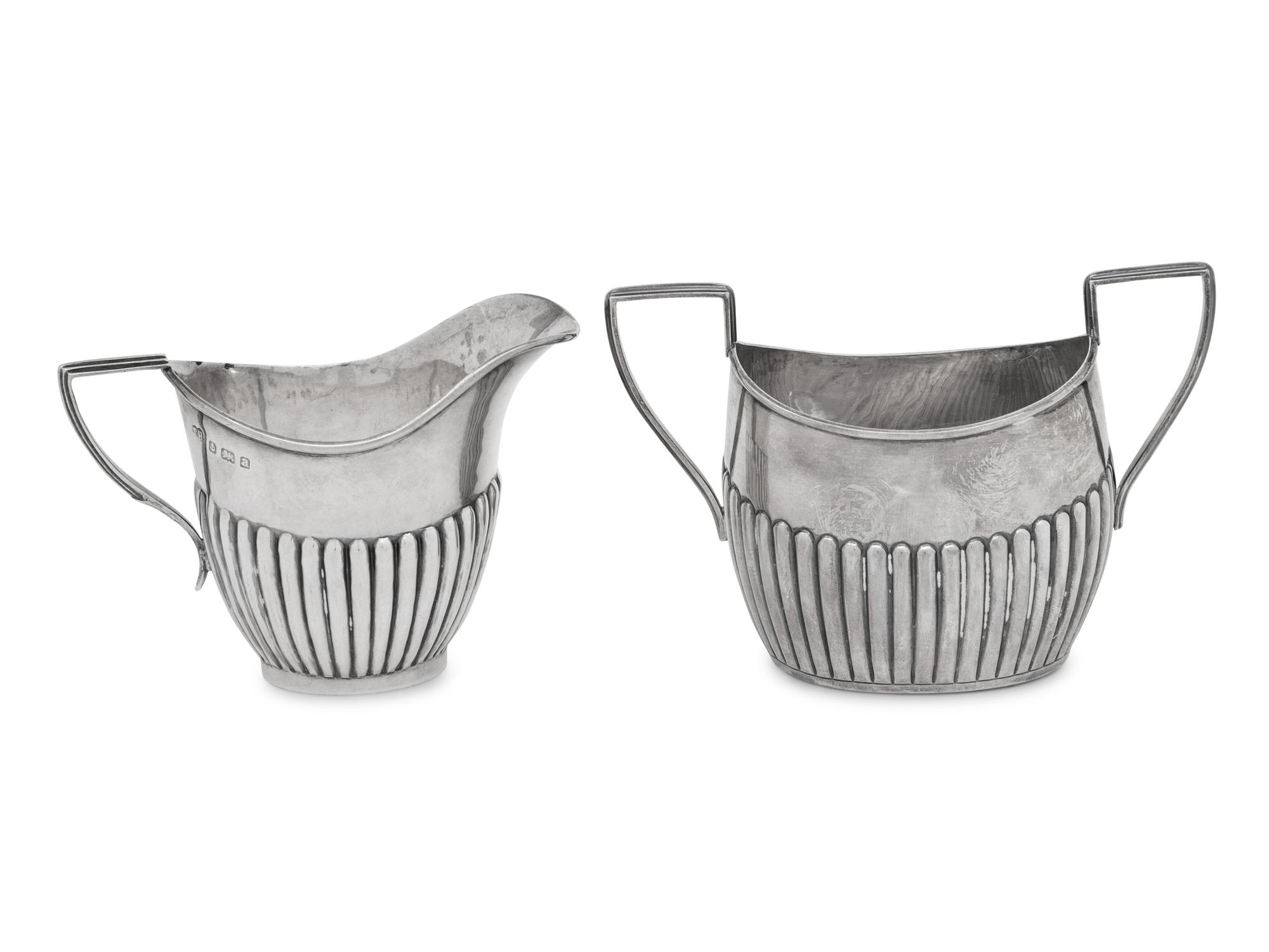An Assembled Edwardian Silver Three-Piece Bachelor's Tea Service