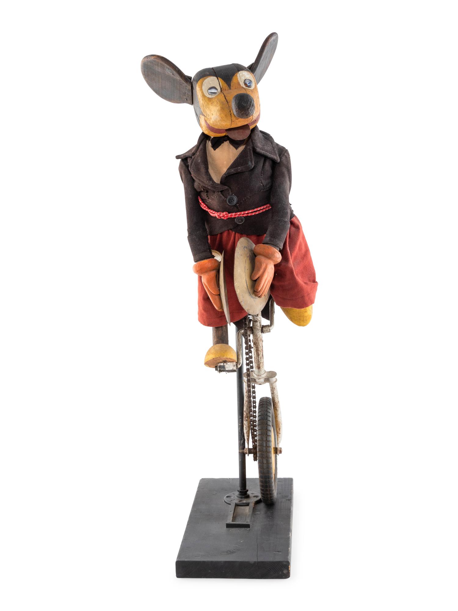 A Carved and Painted Folk Art Mickey Mouse Toy