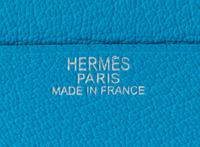 An Hermes Saint Cyr Blue Leather Evelyne Wallet, 4" x 4" x .25".