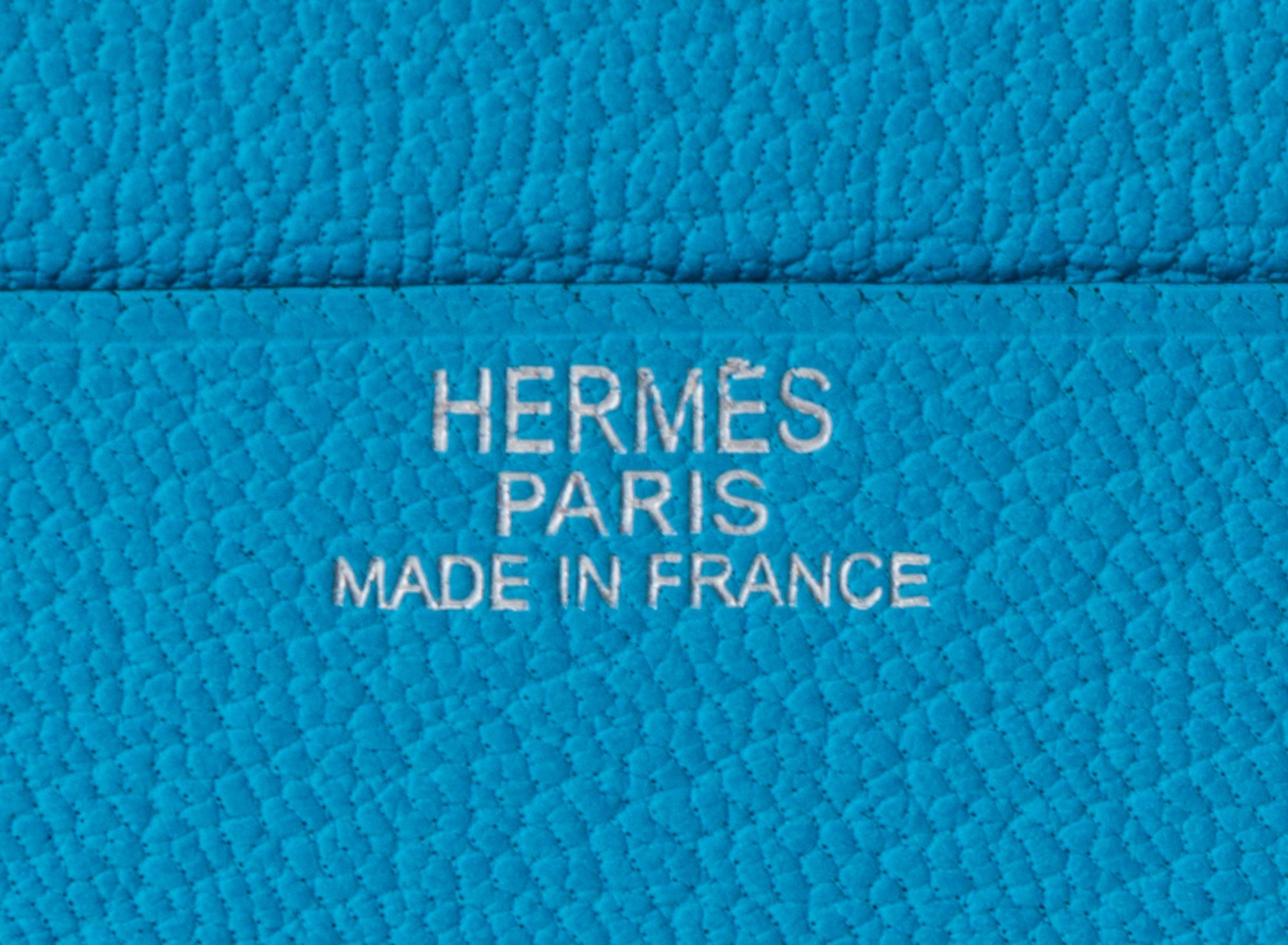 An Hermes Saint Cyr Blue Leather Evelyne Wallet, 4" x 4" x .25".