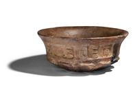A Maya Terracotta Vessel with Glyphs