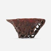 A Chinese Carved Rhinoceros Horn Libation Cup 17th/18th century