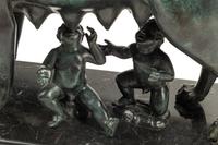 A Grand Tour Style Patinated Bronze Group of Lupa with Romulus and Remus