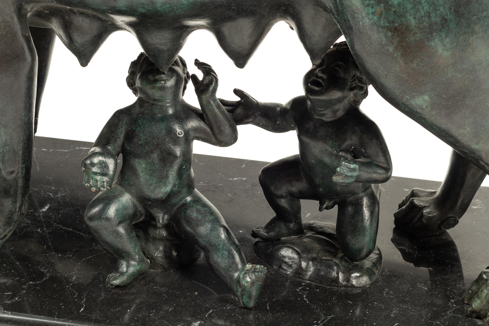 A Grand Tour Style Patinated Bronze Group of Lupa with Romulus and Remus